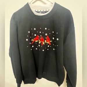 CHRISTMAS SWEATSHIRT KING UNIVERSAL W/RED CARDINALS  AND SNOWFLAKES  SIZE 2XL.